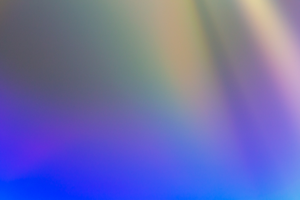 A glass prism splitting a beam of white light into a colour spectrum