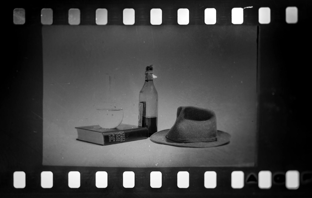 Strips of developed film negatives laid on a light table