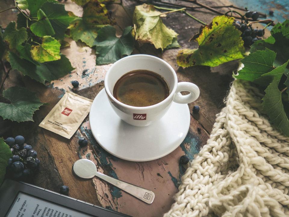 Cup of coffee with detailed latte art poured into the milk foam